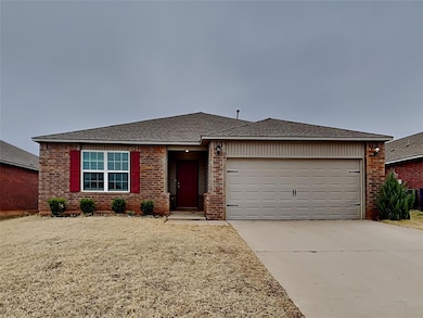 Ranch-style house featuring brick siding, an attached garage, driveway, and a shingled roof