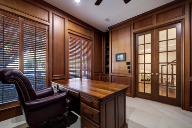 Built-in cabinets, berber carper, french doors and