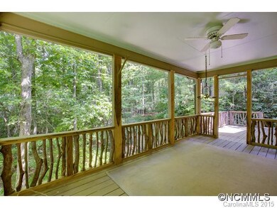 screened porch overlooks woods