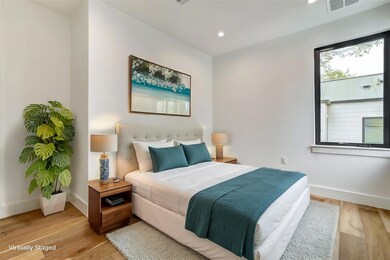 Bedroom with baseboards, light wood finished floo