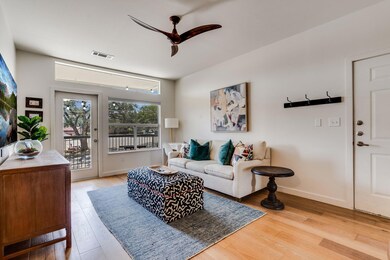 Living room with wood finished floors and a ceili