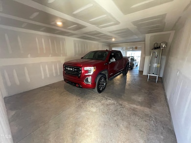 Cars parked in oversized 2.5 car garage.