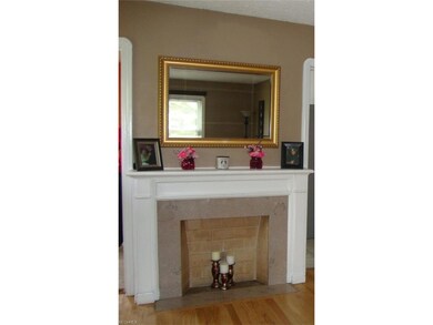 Lovely decorator fireplace is a focal point of the