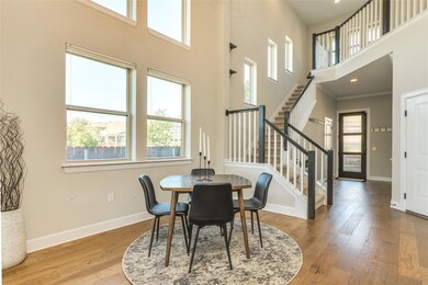 Dining space with crown molding, baseboards, wood