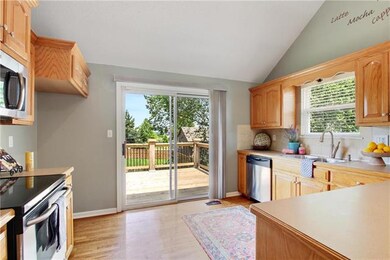 Hardwood floors in kitchen, stainless steel applia