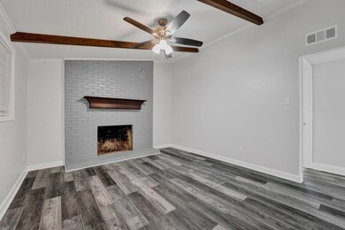 Unfurnished living room with vaulted ceiling with 