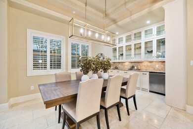 DINING - Dining room features tray ceiling with co