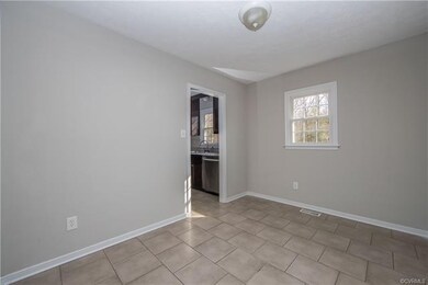 view from tiled dining room to kitchen