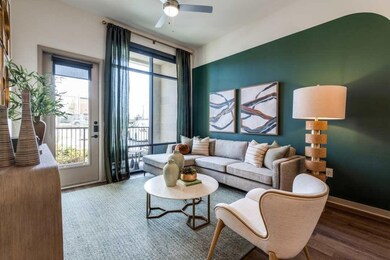 Living room with wood-type flooring and ceiling fa