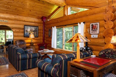 Living room featuring wooden ceiling, high vaulted