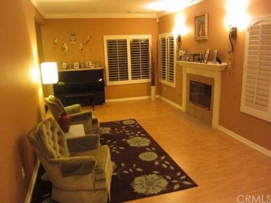 LIVING ROOM W/FIREPLACE - PLANTATION SHUTTERS