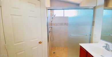 Full bathroom featuring vanity and tiled shower
