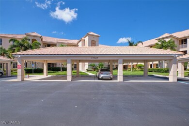 View of car parking featuring a carport