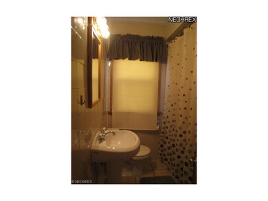 Full bath with ceramic tile floor.