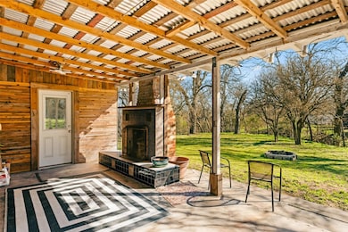 View of patio featuring a fireplace