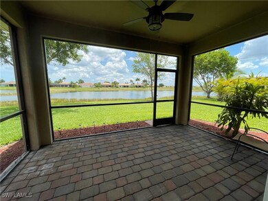 Unfurnished sunroom featuring ceiling fan, a water view, and plenty of natural light