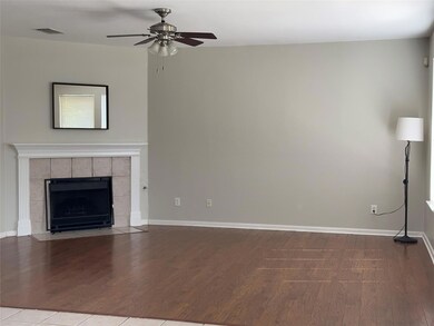 Unfurnished living room with a ceiling fan, wood 