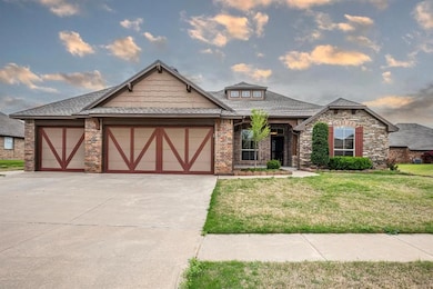 View of front of house with a garage, a front yard