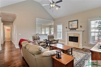 Living room has gas fireplace nad open to kitchen,