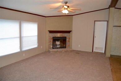 Living room with woodturning fireplace.