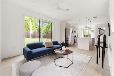 Living area with light wood finished floors, plen