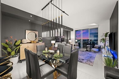 Dining space featuring a wall of windows and light tile patterned floors