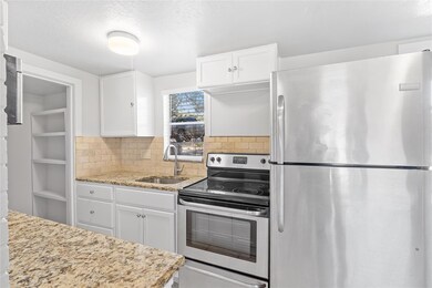 Kitchen featuring appliances with stainless steel