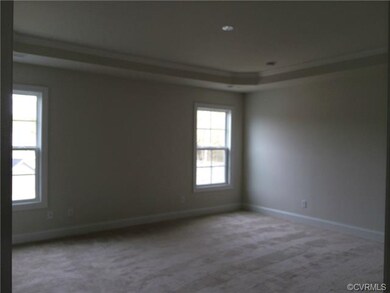 Master bedroom features a Tray Ceiling, 2 Walk in 