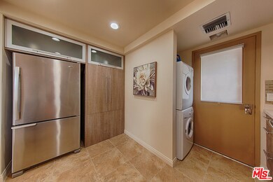 The kitchen showing laundry area