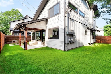 Rear view of property with a fenced backyard, a p
