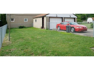 Yard/Garden. Large rear yard with chain link fenci