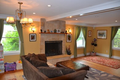 large living room with wood burning fireplace