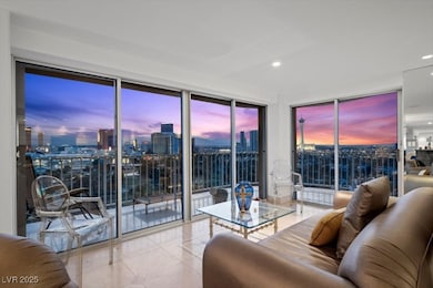 Living room with floor to ceiling windows, light tile patterned flooring, a city view, plenty of natural light, and recessed lighting