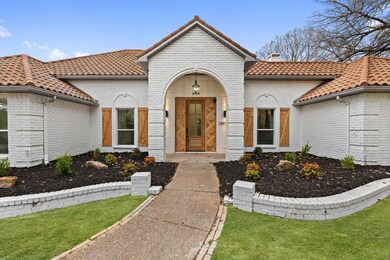 Mediterranean / spanish-style house featuring a fr