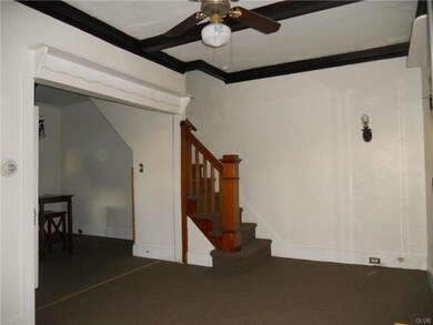 Opposite View of Living Room with Second Floor Sta