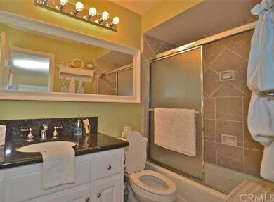 Granite counters & tile shower.