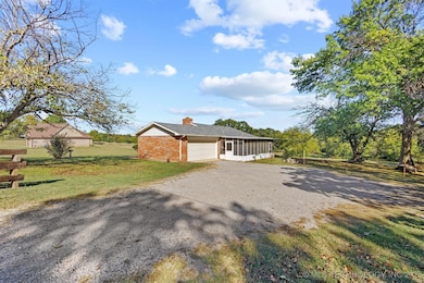 Driveway to attached 2-car garage and enclosed back patio