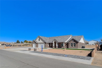 View of front of house featuring concrete driveway