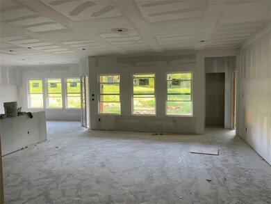 Huge living room with tons of natural light opens 