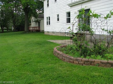 Large back yard with gardens and patio