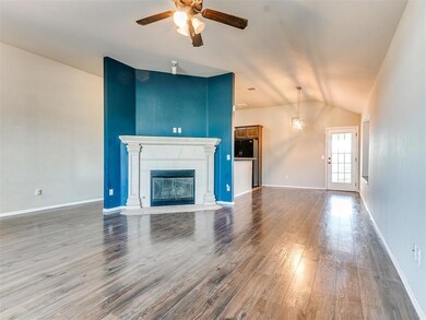 Unfurnished living room featuring a tiled fireplac