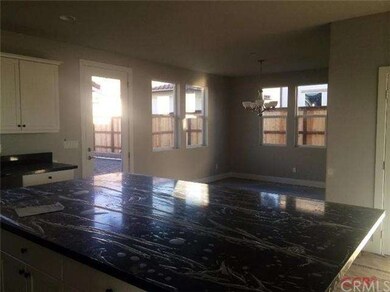 Open concept with dining area off kitchen and acce