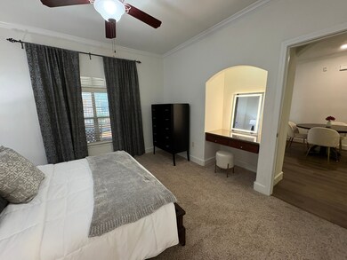 Master bedroom with built-in desk/vanity area