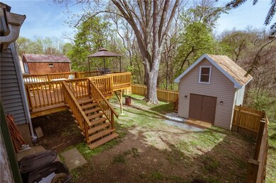 GORGEOUS CEDAR STAINED BACK DECK & STEPS TO FENCED