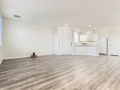 Unfurnished living room with light wood finished f