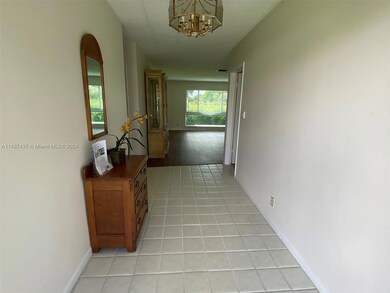 Foyer entrance separates the two (split) bedrooms and creates formal entry into living room.