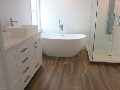 Wood style tile flooring adds to the stylish desig