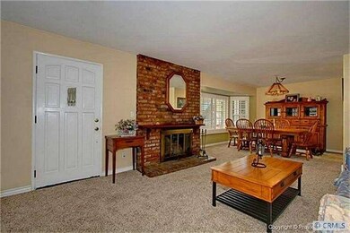 Enter into the Formal Living and Dining. Cozy Bric