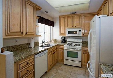 Designer kitchen with granite counters and travert