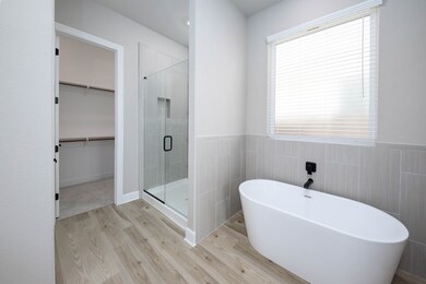The master bedroom offers an incredible bathroom w